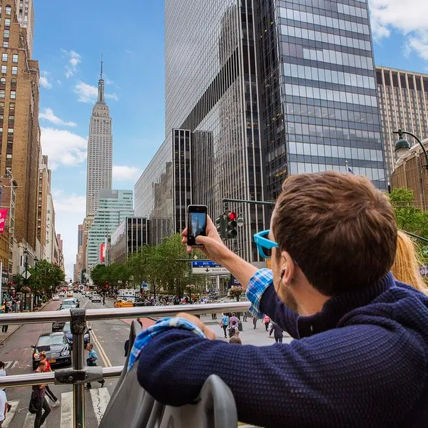 Stunning view of NYC landmarks like the Statue of Liberty and Ellis Island from a private boat.
