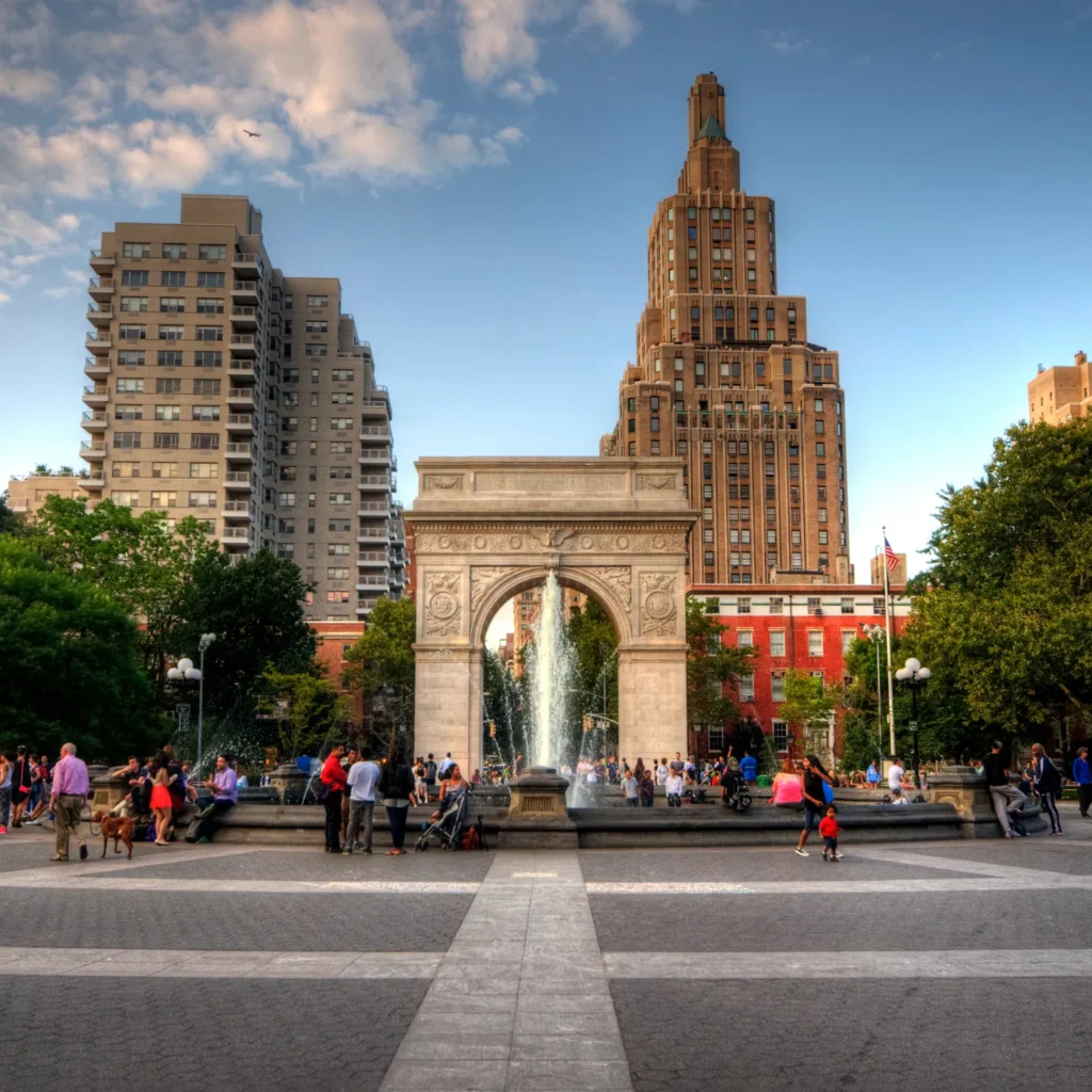 Private boat cruising near the Brooklyn Bridge in New York City.